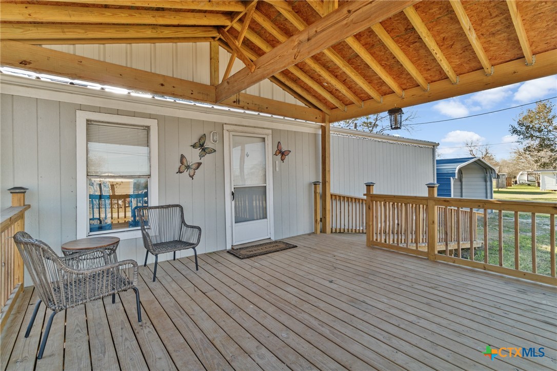 705 Peabody Street Edna, TX 77957 - Photo 4 of 24 a view of a patio with wooden floor