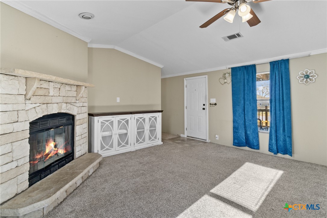 705 Peabody Street Edna, TX 77957 - Photo 7 of 24 a living room with furniture and a fireplace