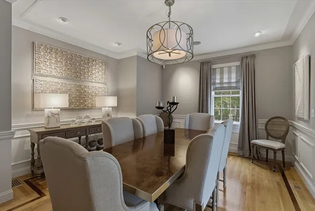 a view of a patio with couches and a table and chairs with garden view