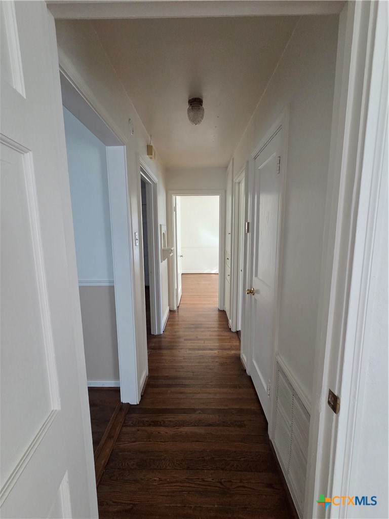 1506 South 9th Street Temple, TX 76504 - Photo 10 of 17 a view of a hallway with wooden floor