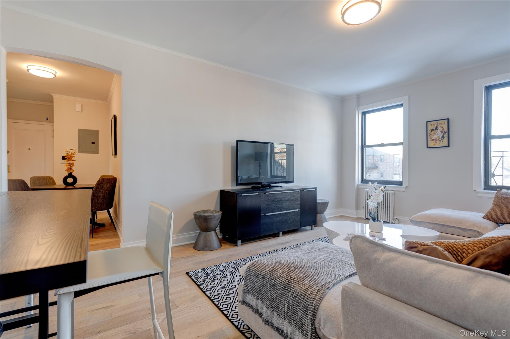 2226 76th Street, Unit C3 Queens, NY 11370 - Photo 13 of 20 a bedroom with a bed and wooden floor