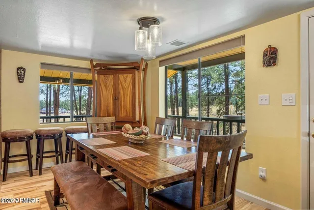 a view of a dining room with furniture window and outside view