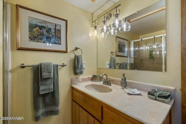 a bathroom with a sink and a mirror