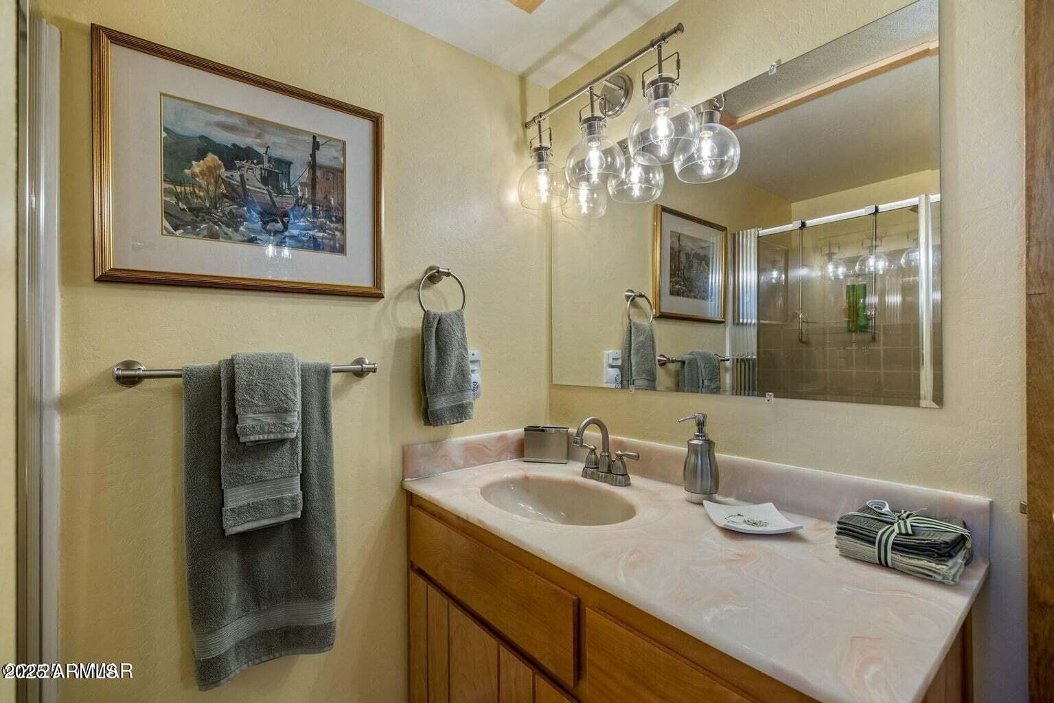 61 County Road 2266 Alpine, AZ 85920 - Photo 24 of 51 a bathroom with a sink and a mirror
