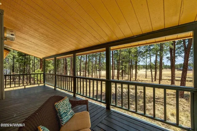 a balcony with wooden floor in outdoor space