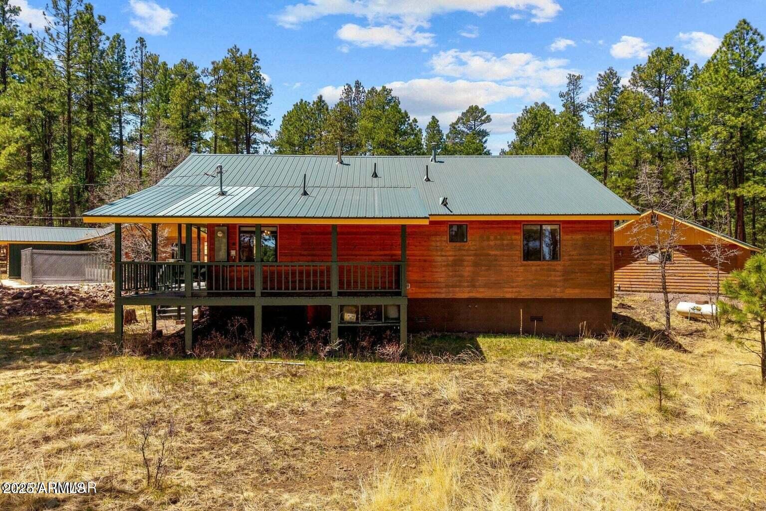 61 County Road 2266 Alpine, AZ 85920 - Photo 35 of 51 a view of a house with a yard and sitting area