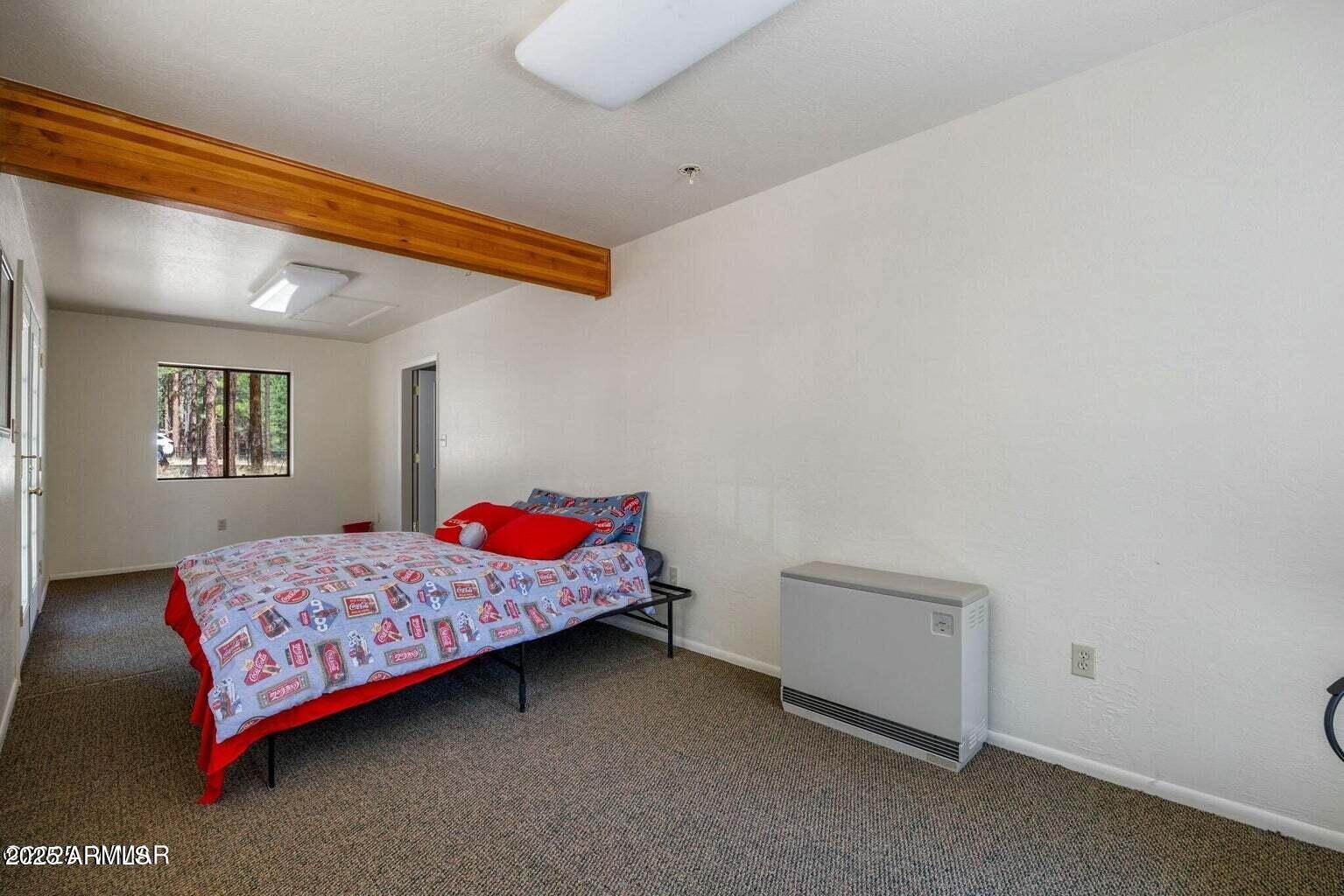 61 County Road 2266 Alpine, AZ 85920 - Photo 41 of 51 a bedroom with a bed and window