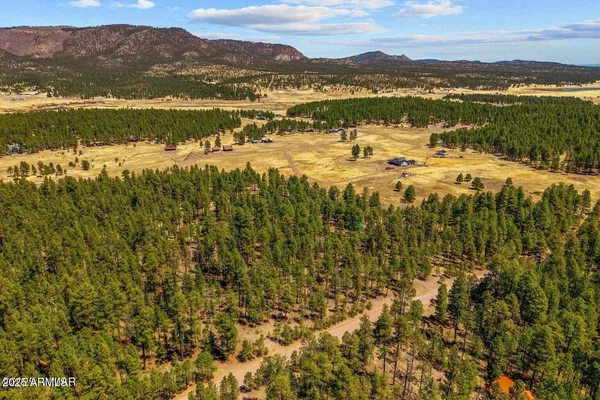 an aerial view of residential house with parking space