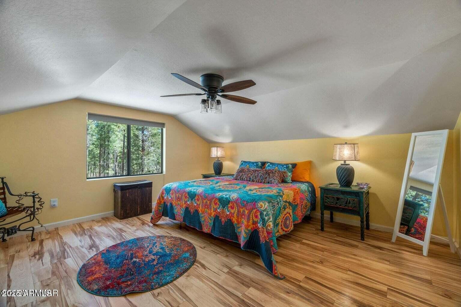 61 County Road 2266 Alpine, AZ 85920 - Photo 7 of 51 a bedroom with a bed and wooden floor