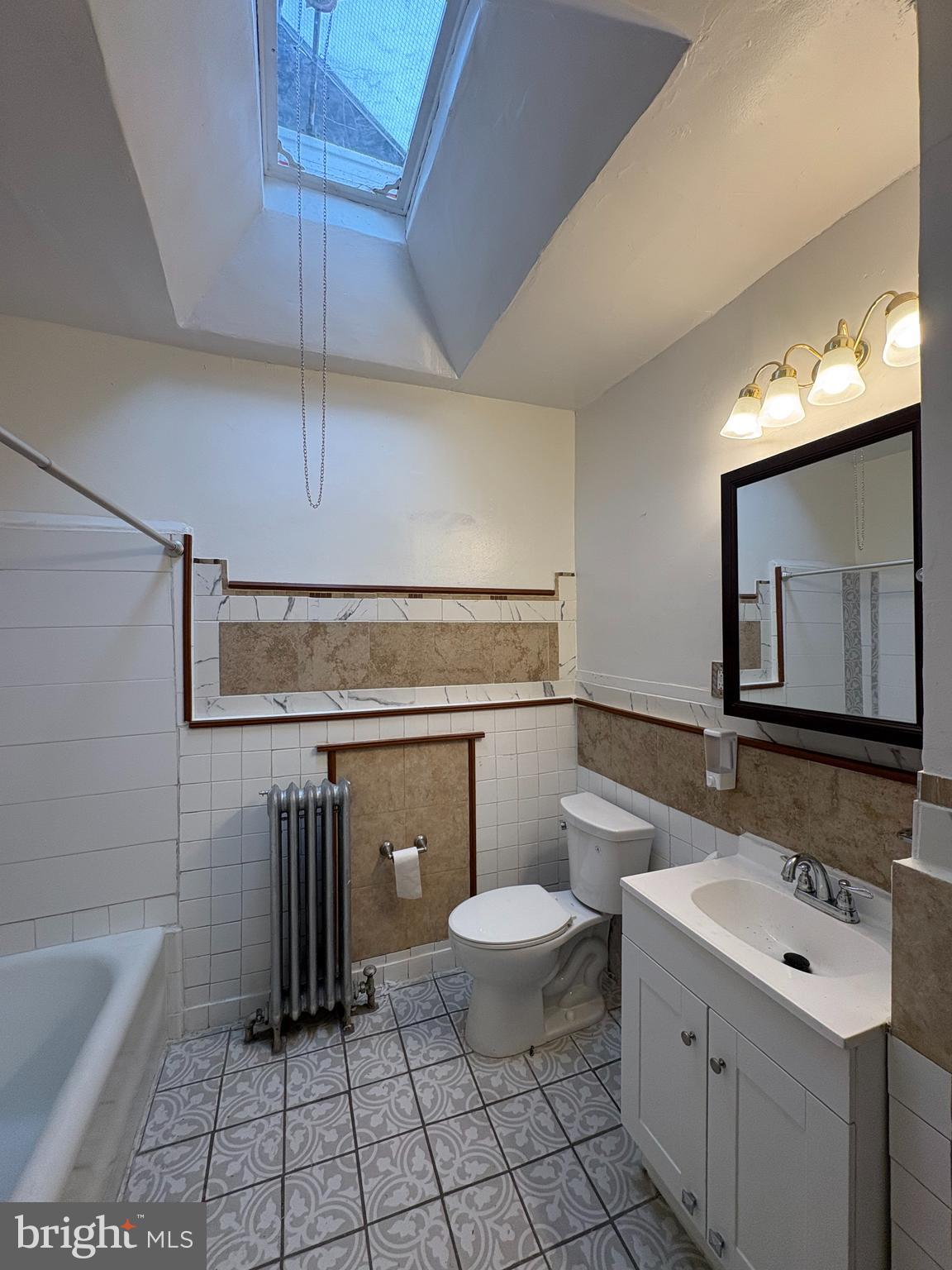 3219 North 29th Street Philadelphia, PA 19129 - Photo 13 of 16 a bathroom with a sink a toilet and bathtub