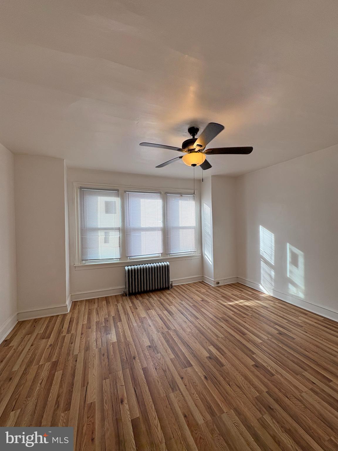 3219 North 29th Street Philadelphia, PA 19129 - Photo 14 of 16 a view of empty room with wooden floor and fan