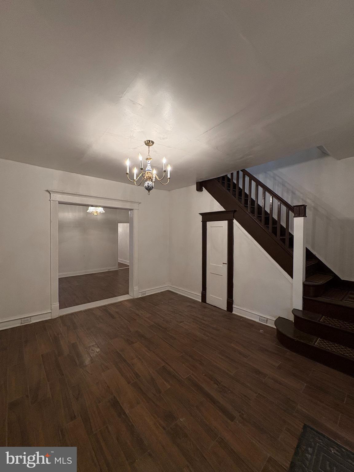 3219 North 29th Street Philadelphia, PA 19129 - Photo 3 of 16 a view of an empty room with wooden floor and a window