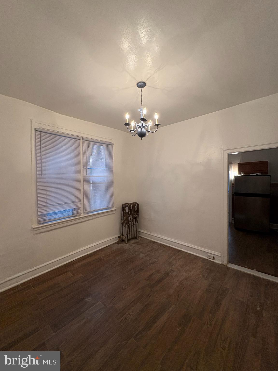 3219 North 29th Street Philadelphia, PA 19129 - Photo 5 of 16 a view of an empty room with wooden floor and a window