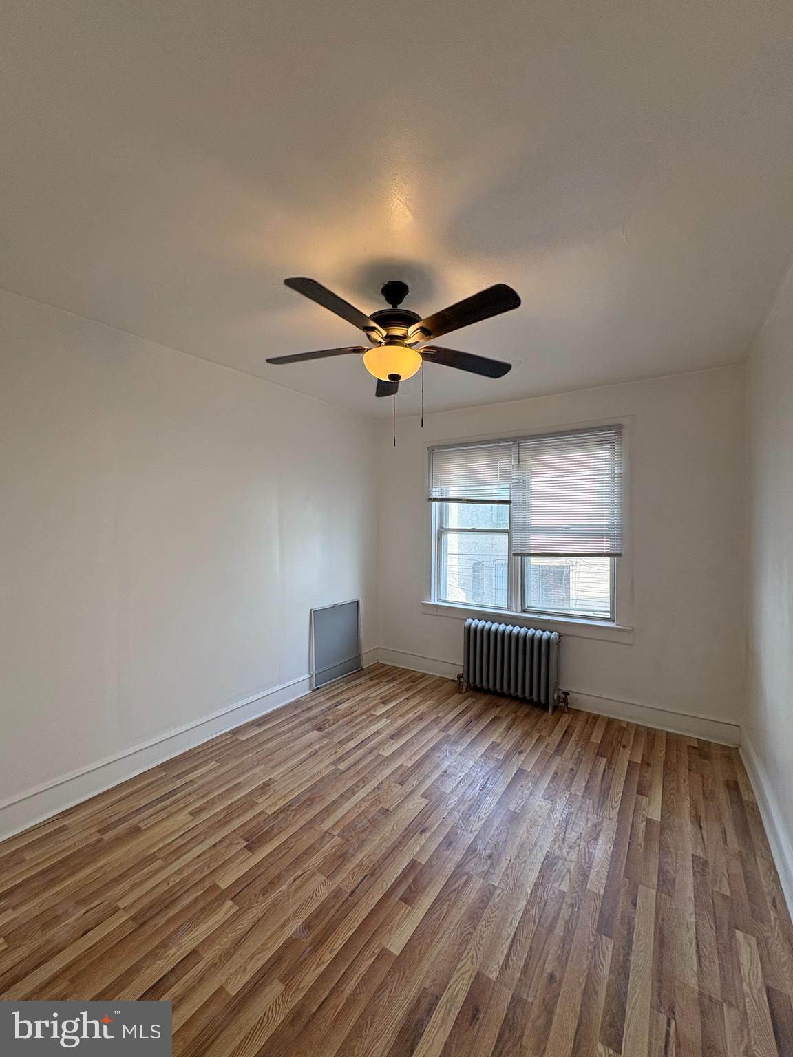 3219 North 29th Street Philadelphia, PA 19129 - Photo 10 of 16 a view of empty room with wooden floor and fan