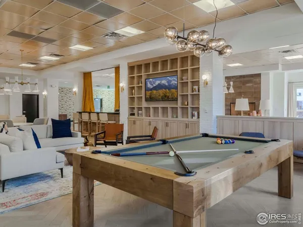 a room with lots of table and chairs