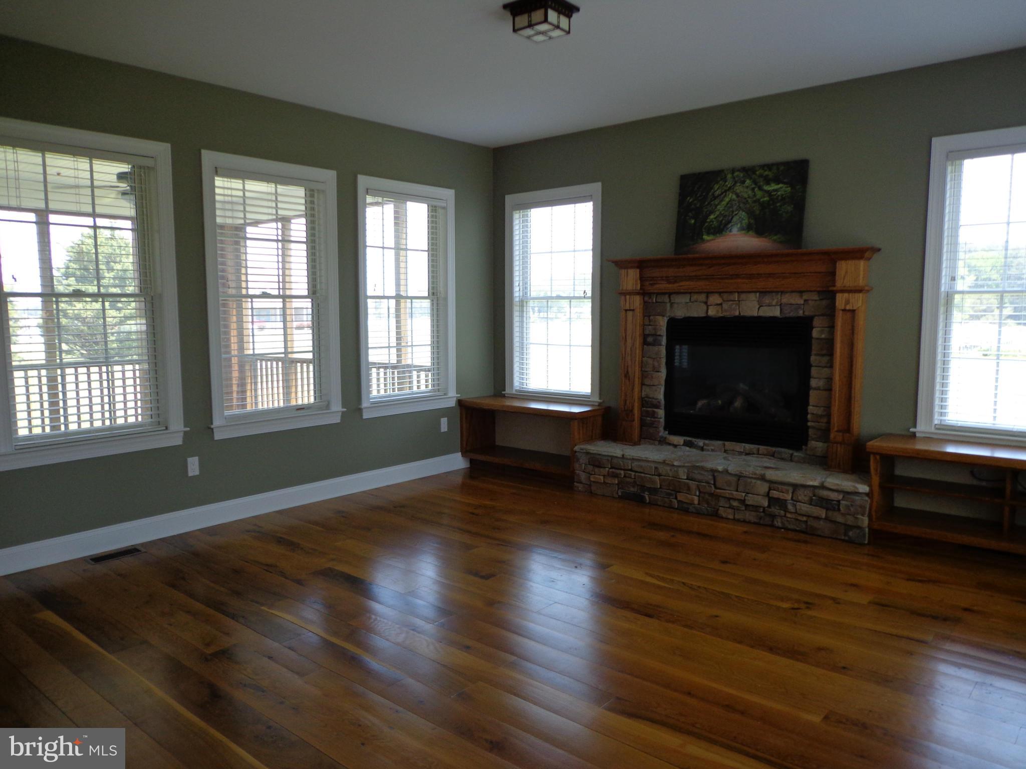 16010 Pleasure Point Ln Ridge Ridge, MD 20680 - Photo 13 of 26 Family Room w/ stone fireplace