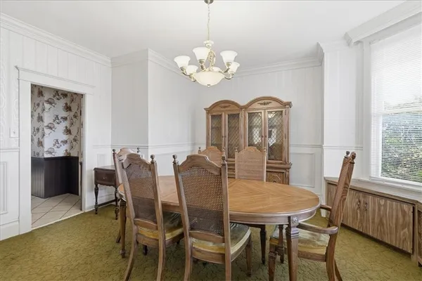 a view of a dining room with furniture window and outside view