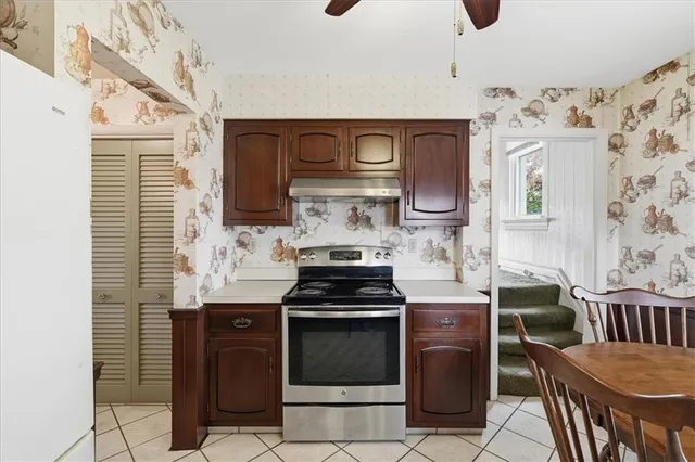 a kitchen with a stove and a refrigerator