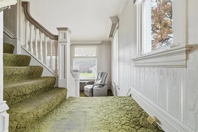 a bedroom with furniture and a window