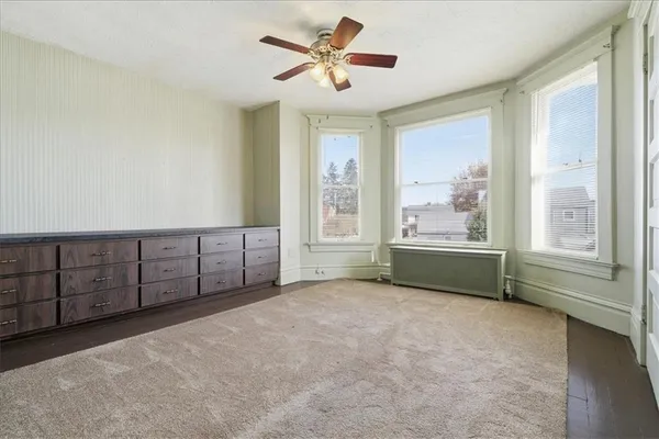 a view of workspace with furniture and window