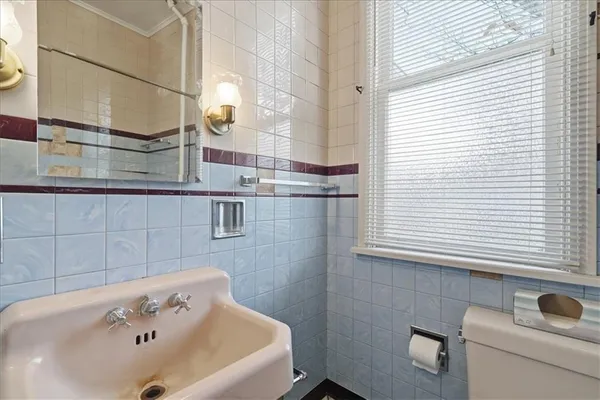 a bathroom with a bathtub and sink