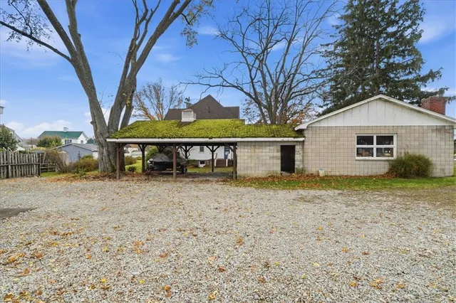 a barn with a table and chairs