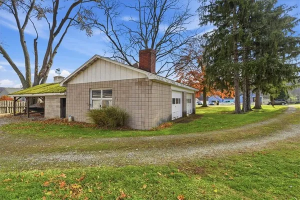 a view of a house with a yard