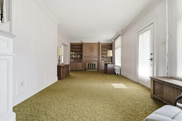 a view of a livingroom with furniture and windows