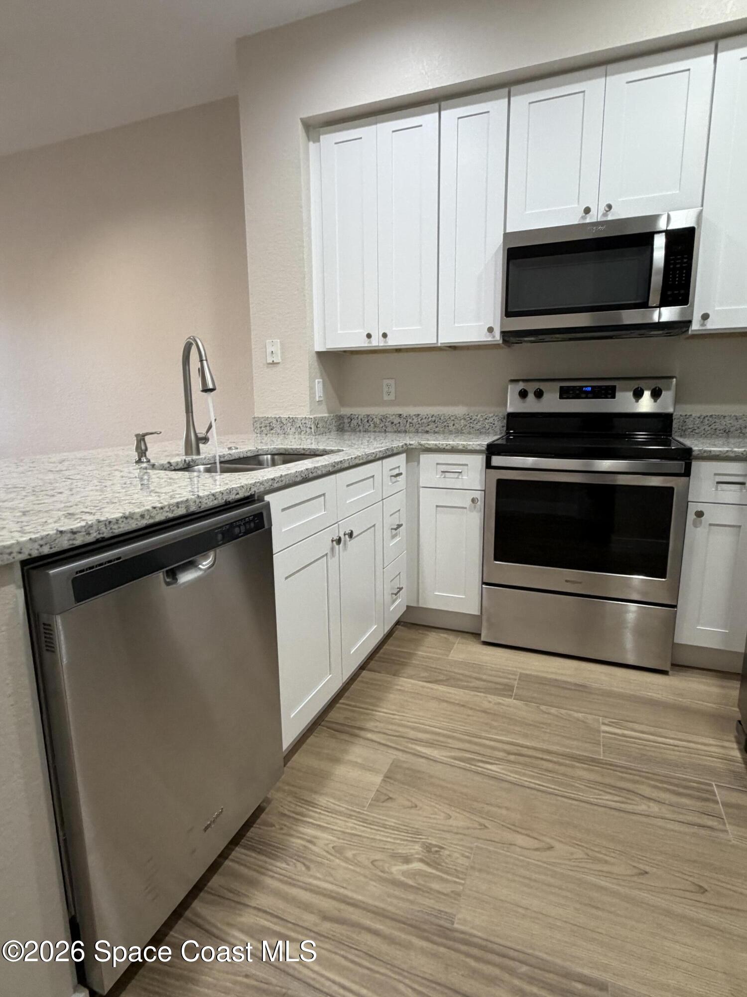 105 Turpial Way, Unit 103 Melbourne, FL 32901 - Photo 7 of 31 IMG_0575