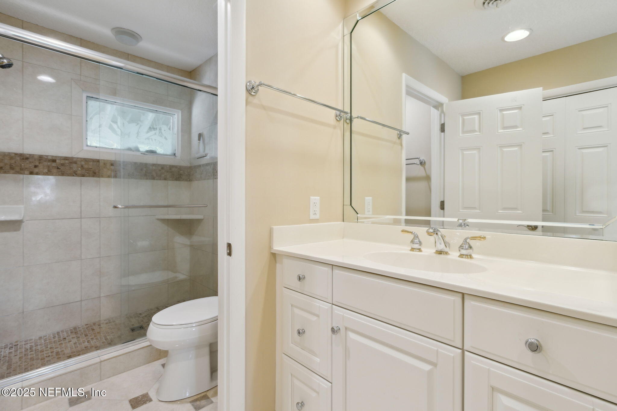 3417 Sea Marsh Road Fernandina Beach, FL 32034 - Photo 15 of 19 a bathroom with a sink a toilet and shower