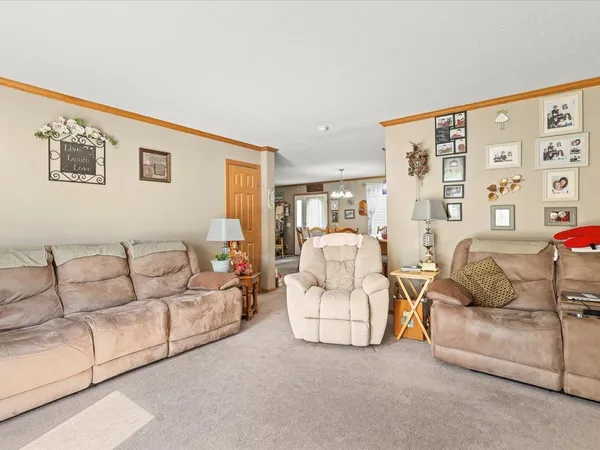 a room with a sink cabinets and couch
