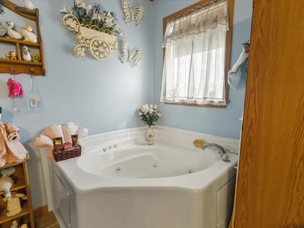 a view of a storage and utility room with washer and dryer