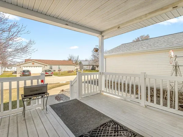 a view of a porch with wooden floor