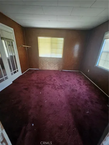 a view of an empty room and window