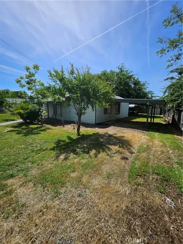 a backyard of a house with lots of green space