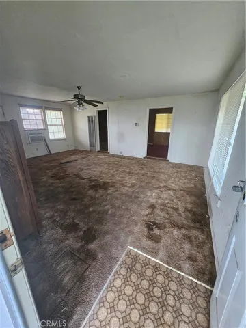 a view of an empty room and window