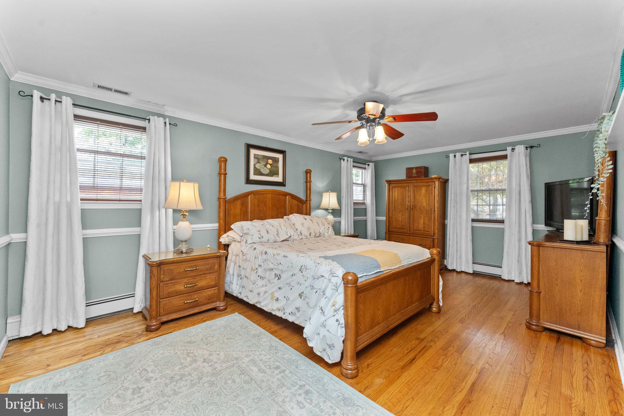 169 Centenary Lane Warminster, PA 18974 - Photo 17 of 28 a bedroom with a large bed a chandelier and dresser