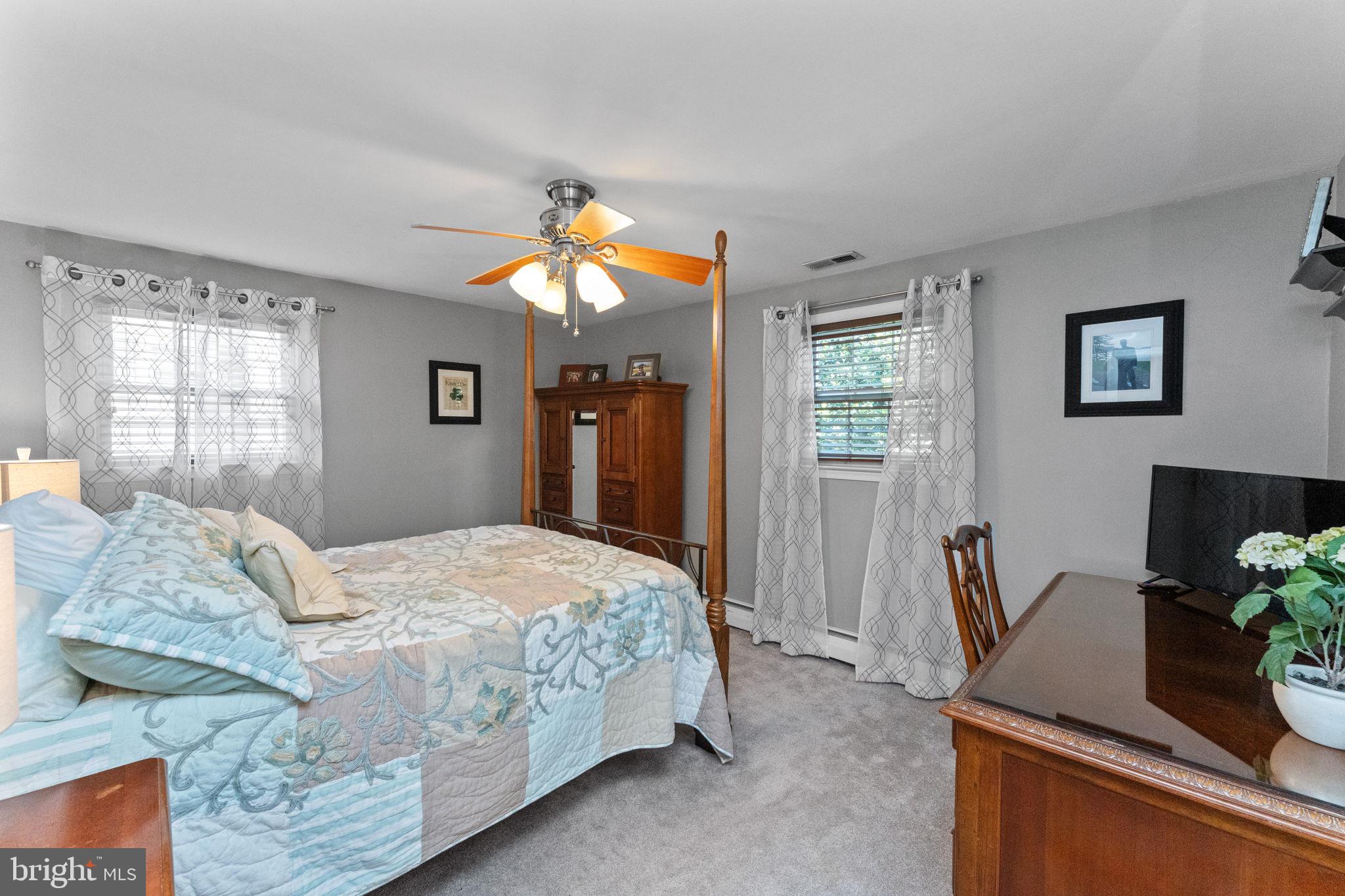 169 Centenary Lane Warminster, PA 18974 - Photo 22 of 28 a bedroom with a bed and dresser with mirror