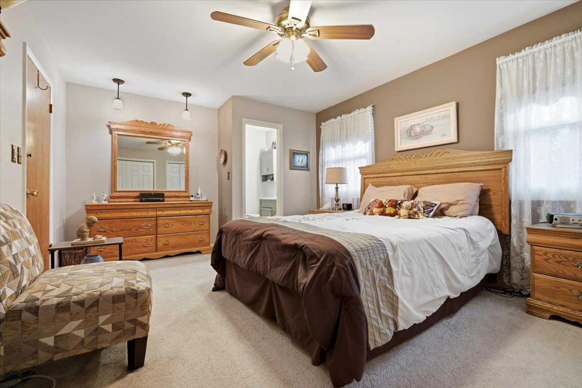 1204 Westview Drive Normal, IL 61761 - Photo 13 of 25 a bedroom with a bed and ceiling fan
