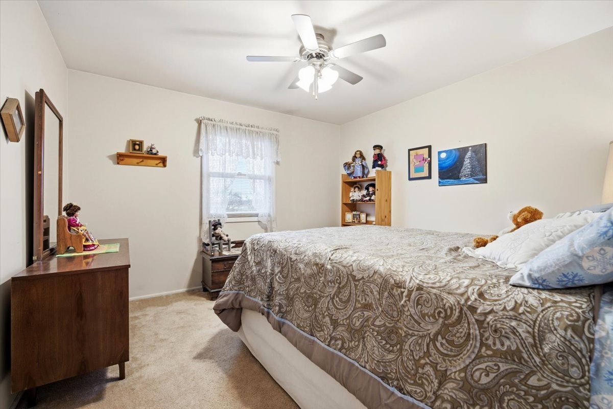1204 Westview Drive Normal, IL 61761 - Photo 15 of 25 a bedroom with a bed and a couch