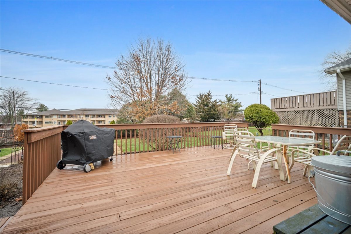 1204 Westview Drive Normal, IL 61761 - Photo 20 of 25 a roof deck with table and chairs potted plants with wooden floor and fence