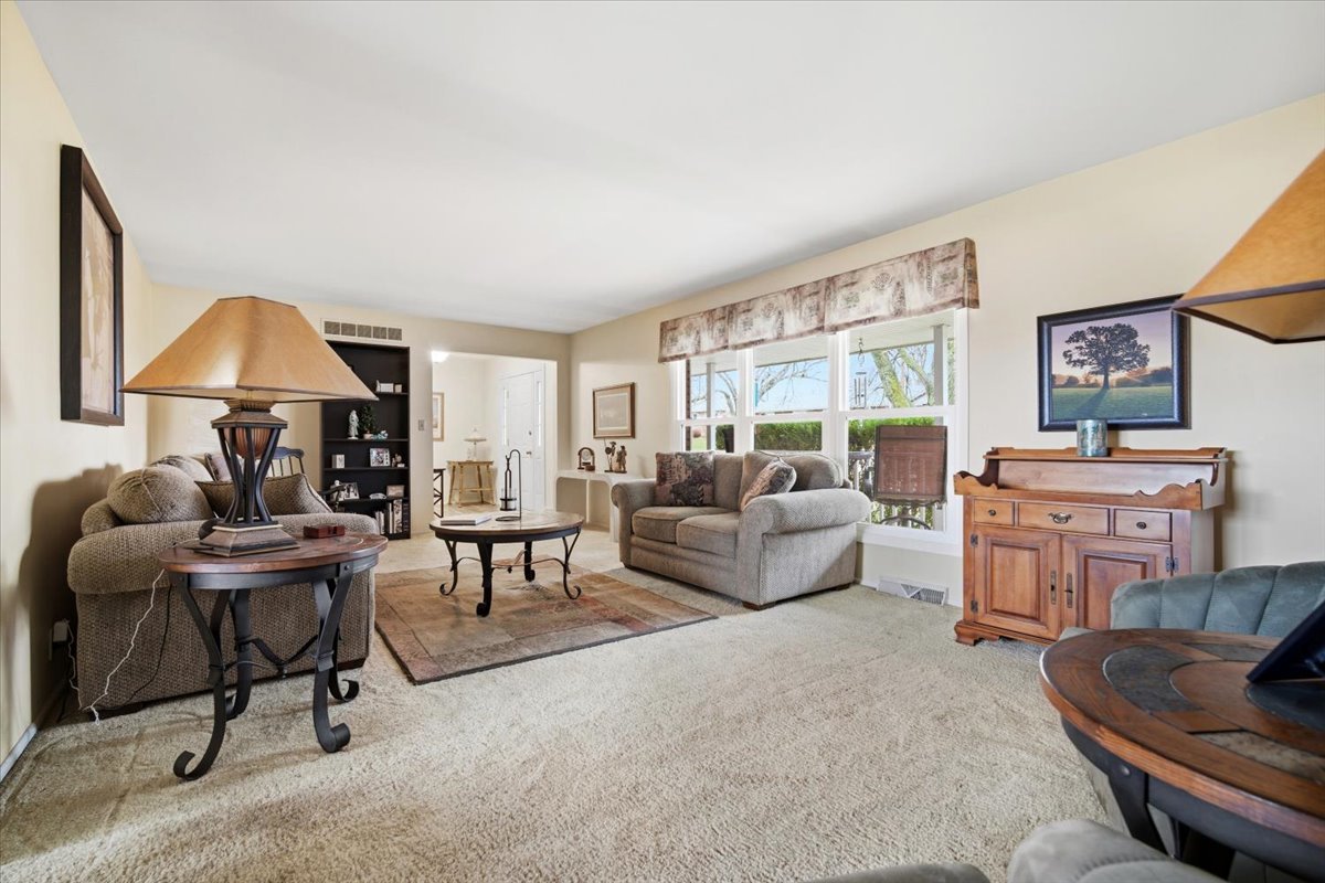 1204 Westview Drive Normal, IL 61761 - Photo 5 of 25 a living room with furniture a lamp and a window