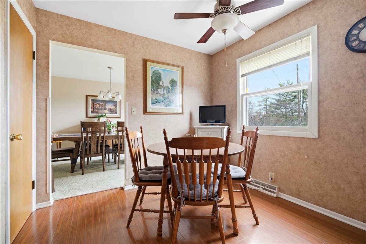 1204 Westview Drive Normal, IL 61761 - Photo 8 of 25 a view of a dining room with furniture window and wooden floor