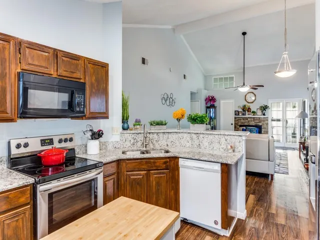 a front view of house with yard and outdoor seating