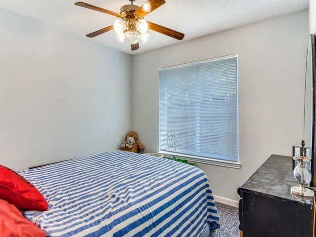 a kitchen with kitchen island granite countertop stainless steel appliances stove a sink and dishwasher with wooden floor