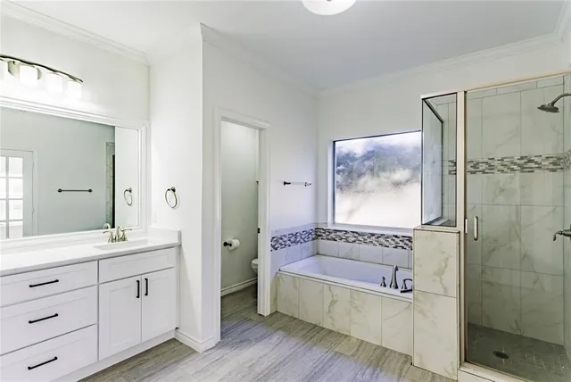 a spacious bathroom with a double vanity sink a mirror and a shower