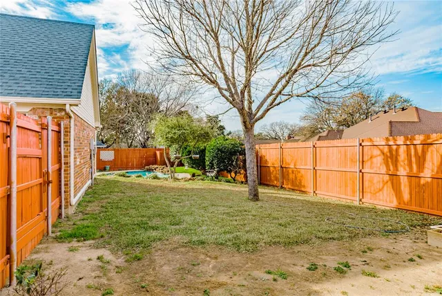 a house view with swimming pool in front of it