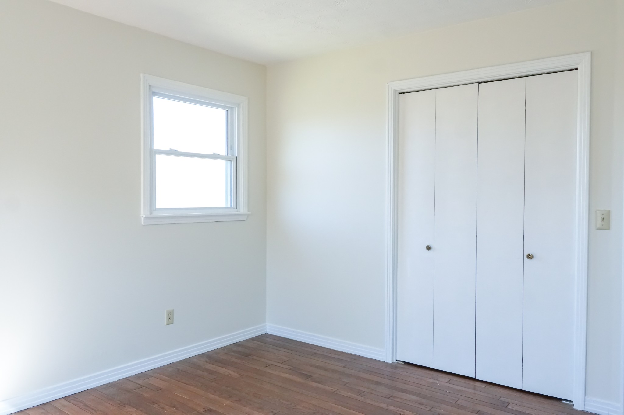 6250 Brown Ridge Road Baxter, TN 38544 - Photo 54 of 70 an empty room with wooden floor and a window