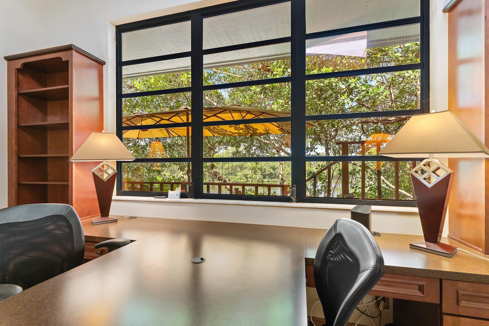 702 Warren Drive Jupiter, FL 33458 - Photo 45 of 76 a view of a workspace with furniture and a window