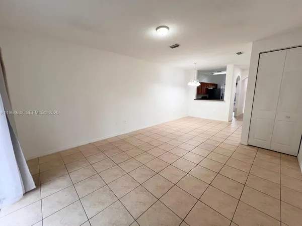 a view of an empty room and window
